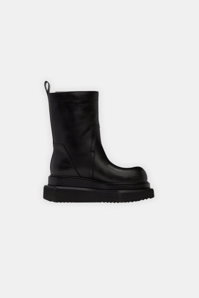 Mid-calf buffed calfskin boots in black. · Pull-loop at heel · Stacked leather midsole · Treaded foam rubber platform sole Color: Black Upper: Calfskin Sole: Rubber